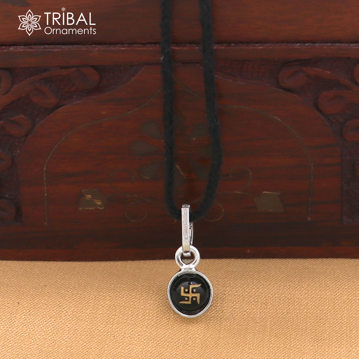 Sterling silver Swastik design pendant for girls and kids jewelry by TRIBAL ORNAMENTS, featuring intricate craftsmanship.