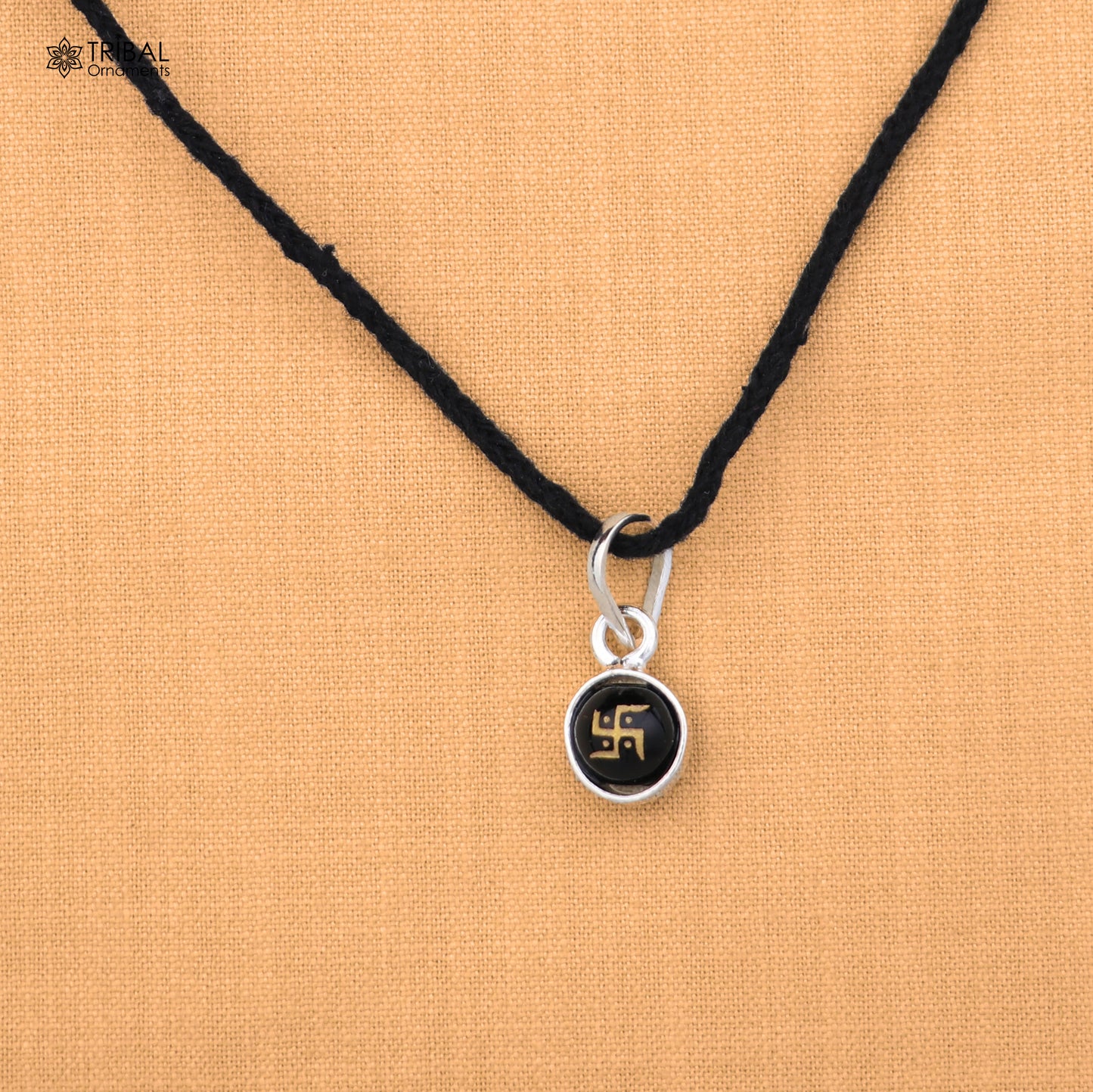 Sterling silver Swastik pendant for girls or kids jewelry, crafted by TRIBAL ORNAMENTS, with intricate design and polished finish.