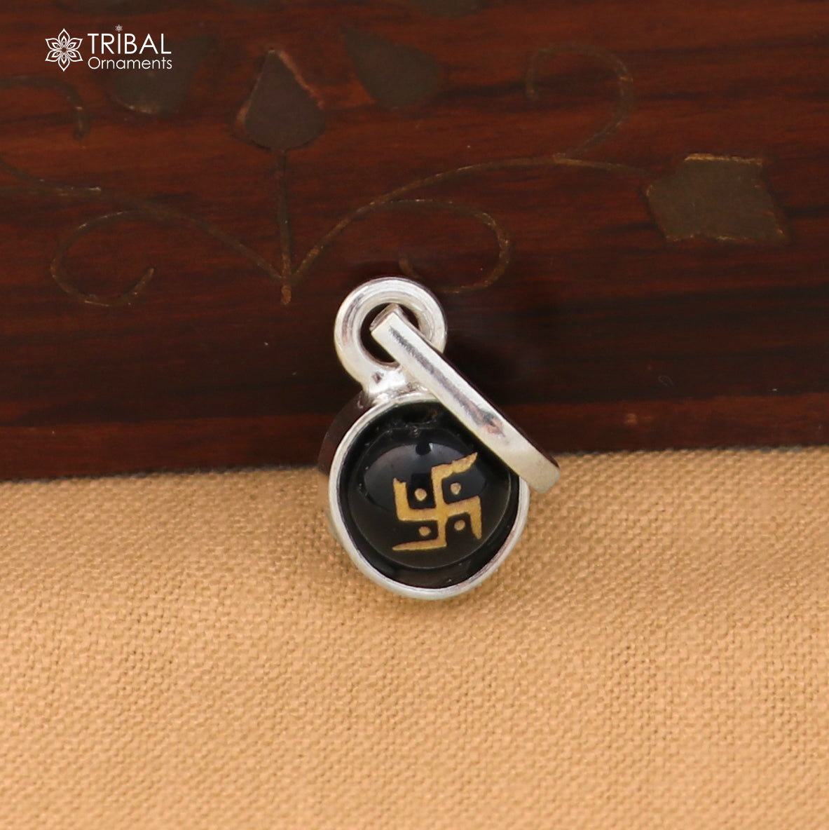 Sterling silver Swastik pendant for girls and kids, featuring intricate tribal design, from TRIBAL ORNAMENTS.
