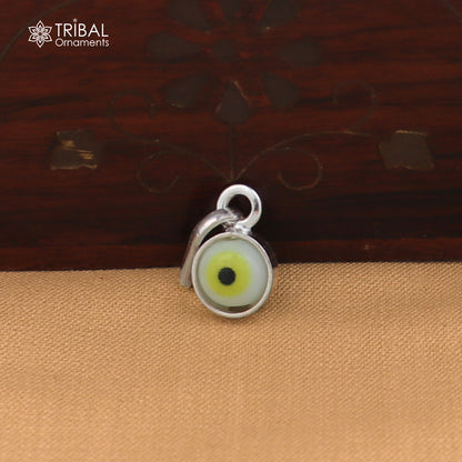 Sterling silver evil eye pendant for girls and kids, protective jewelry by TRIBAL ORNAMENTS, featuring a detailed evil eye design.