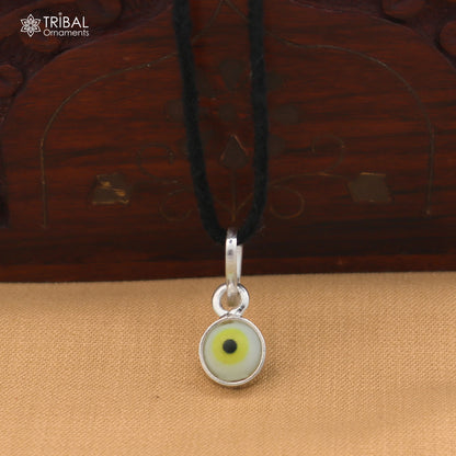Sterling silver evil eye pendant for girls and kids, protective jewelry by TRIBAL ORNAMENTS, featuring a blue and silver design.