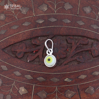925 sterling silver evil eye pendant for girls and kids, protective jewelry by TRIBAL ORNAMENTS, featuring a detailed eye design.