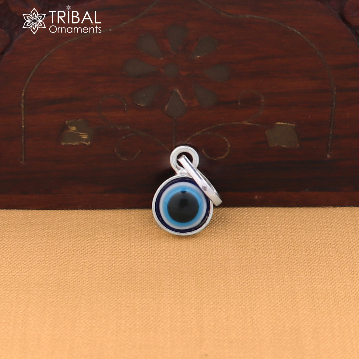 Sterling silver evil eye pendant for kids and unisex, featuring protective jewelry design by TRIBAL ORNAMENTS.