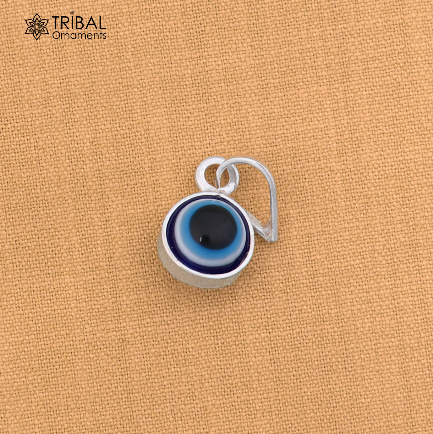 925 sterling silver evil eye pendant for girls and kids, protective jewelry by TRIBAL ORNAMENTS, featuring a blue and silver design.