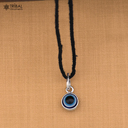 Sterling silver evil eye pendant for girls and kids, protective jewelry by TRIBAL ORNAMENTS, featuring a detailed eye design.