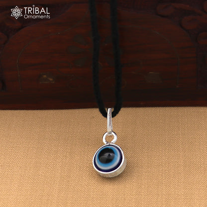 Sterling silver evil eye pendant for girls and kids, tribal jewelry for protection, featuring a blue eye design.