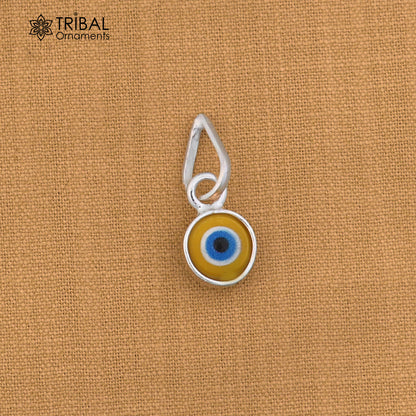 Sterling silver evil eye pendant for girls and kids, protective jewelry by TRIBAL ORNAMENTS, featuring a detailed blue and silver design.
