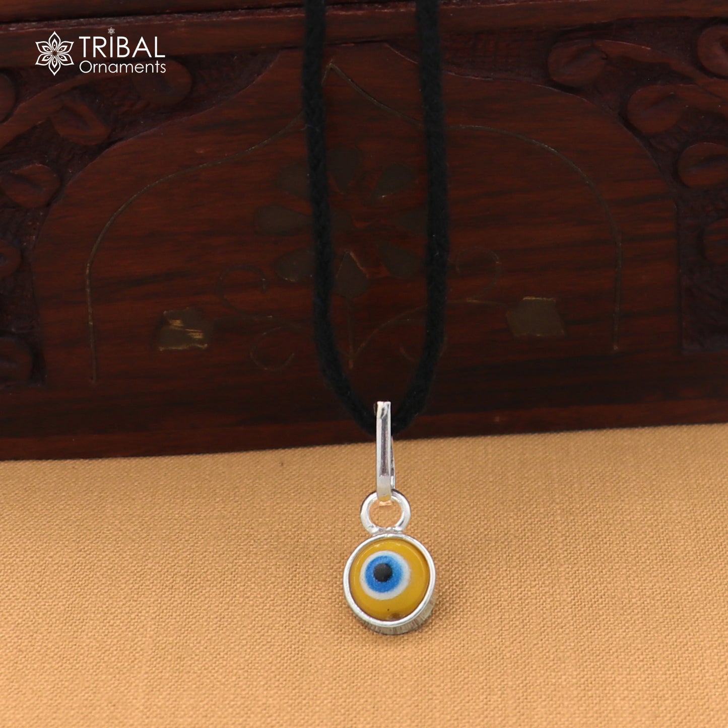 925 sterling silver evil eye pendant for girls or kids, protective jewelry by TRIBAL ORNAMENTS, featuring a detailed evil eye design.
