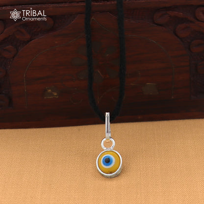 925 sterling silver evil eye pendant for girls or kids, protective jewelry by TRIBAL ORNAMENTS, featuring a detailed evil eye design.