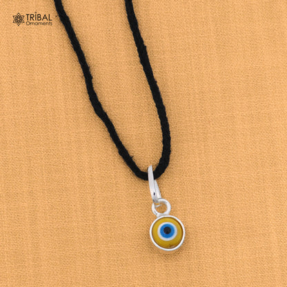 925 sterling silver evil eye pendant for girls and kids, protective jewelry by TRIBAL ORNAMENTS, featuring a blue eye design.