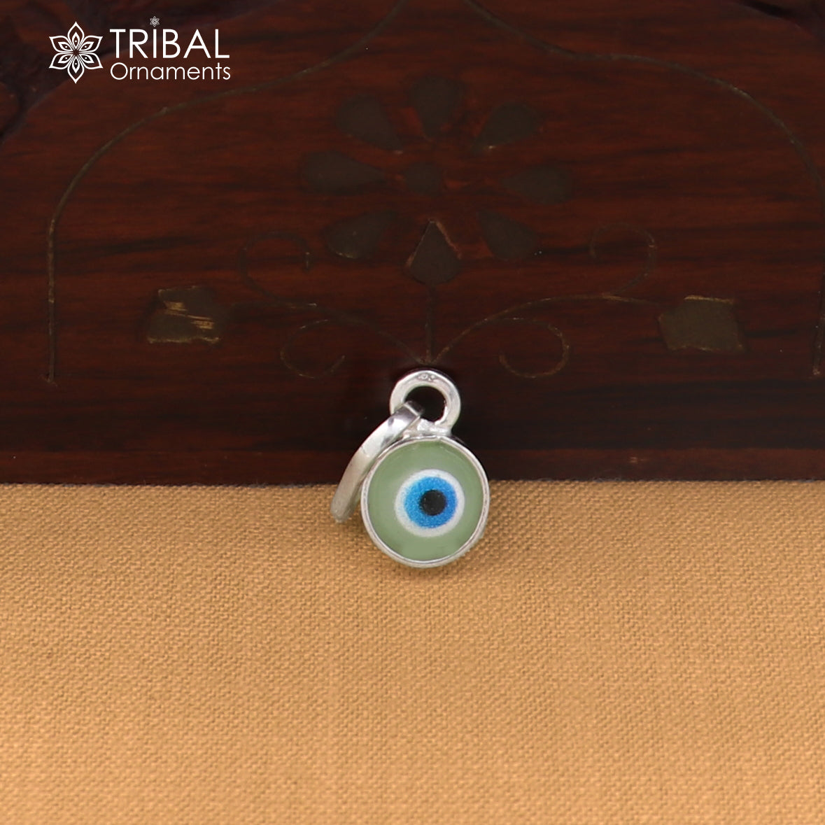 Sterling silver evil eye pendant for girls or kids, protective jewelry, featuring a detailed blue and silver eye design by TRIBAL ORNAMENTS