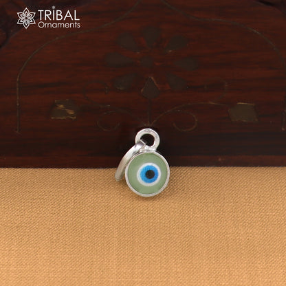 Sterling silver evil eye pendant for girls or kids, protective jewelry, featuring a detailed blue and silver eye design by TRIBAL ORNAMENTS