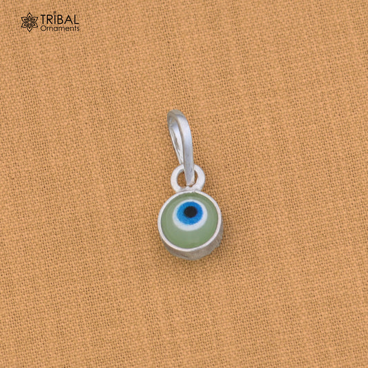 Sterling silver evil eye pendant for girls, protective jewelry by TRIBAL ORNAMENTS, featuring a blue eye design with silver setting.