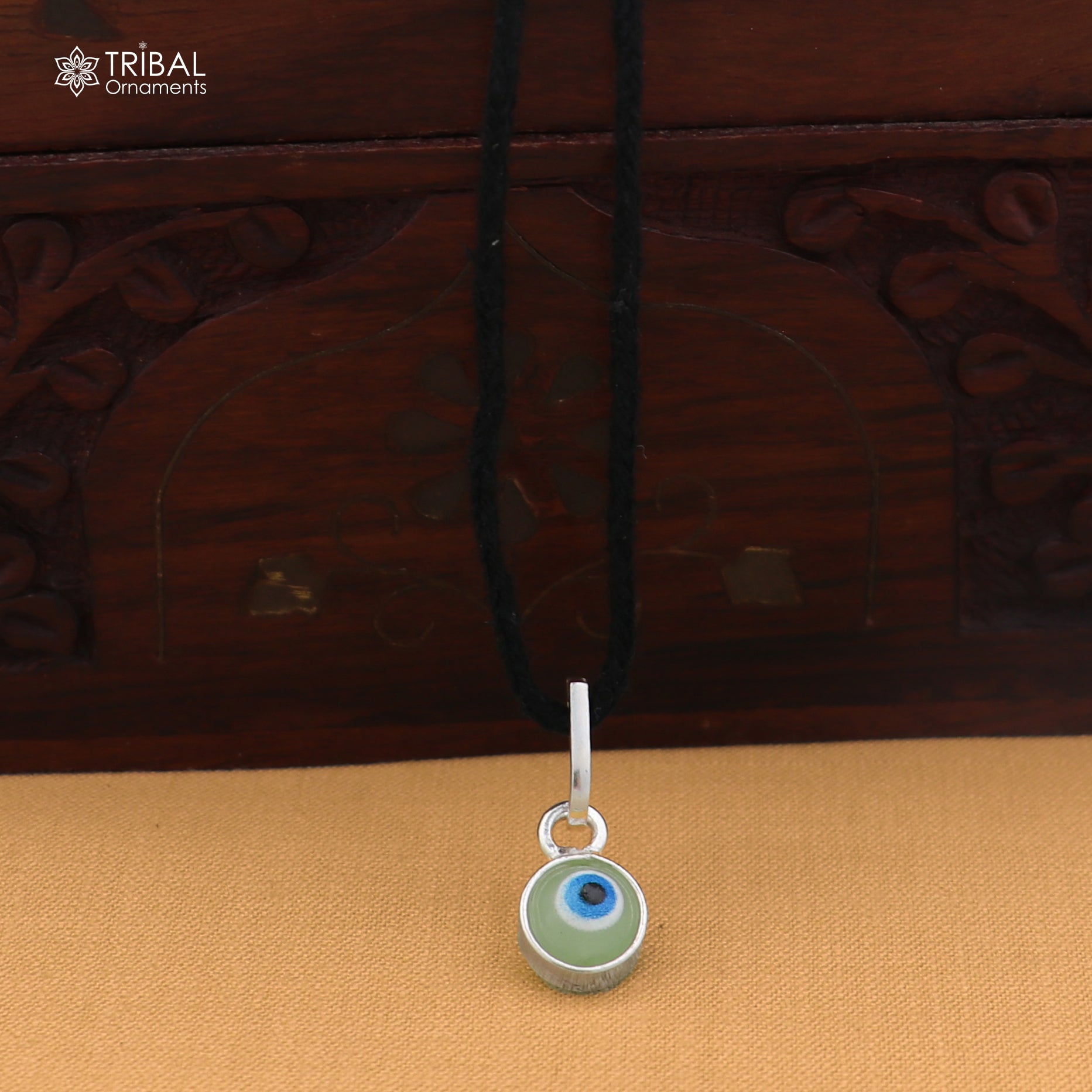925 sterling silver evil eye pendant for girls and kids, protective jewelry by TRIBAL ORNAMENTS, featuring a vibrant blue eye design.