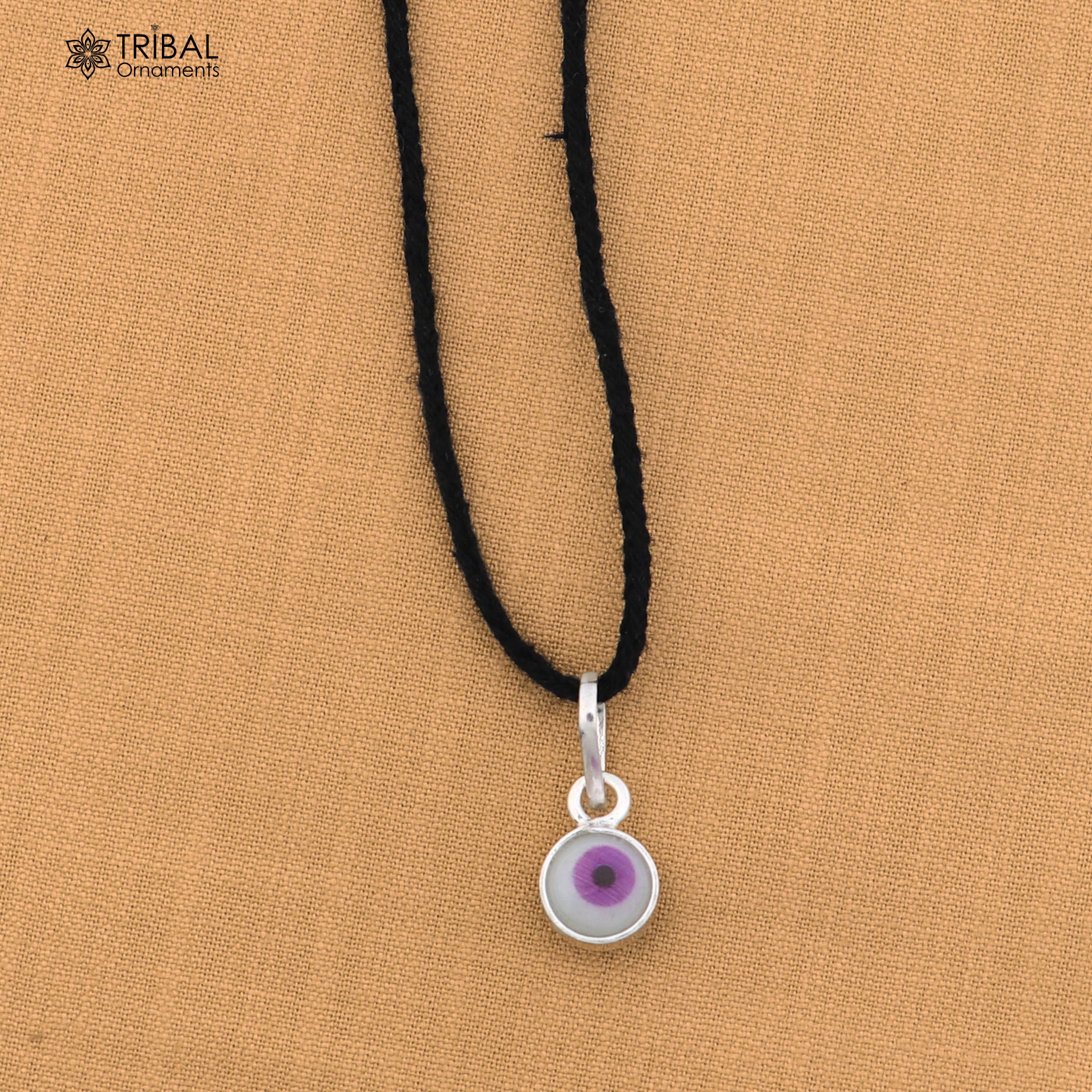 925 sterling silver evil eye pendant for girls or kids, protective jewelry by TRIBAL ORNAMENTS, featuring a blue eye design.