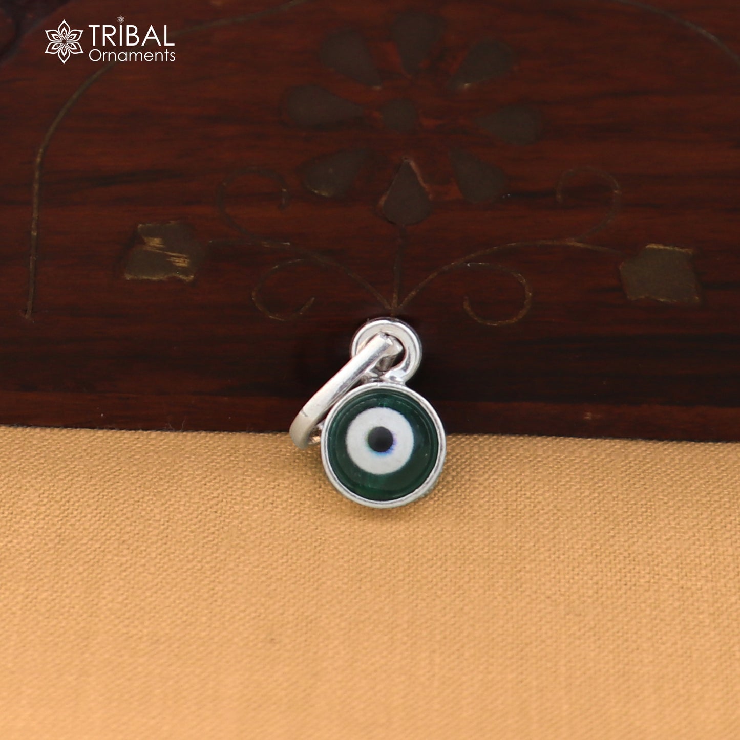 Sterling silver evil eye pendant for girls and kids, protective jewelry by TRIBAL ORNAMENTS, featuring blue and white eye design.