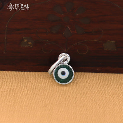 Sterling silver evil eye pendant for girls and kids, protective jewelry by TRIBAL ORNAMENTS, featuring blue and white eye design.