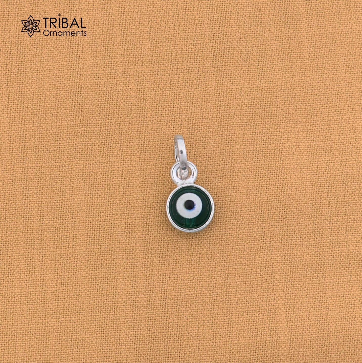 Sterling silver evil eye pendant for girls and kids, protective jewelry by Tribal Ornaments, featuring a blue and silver design.