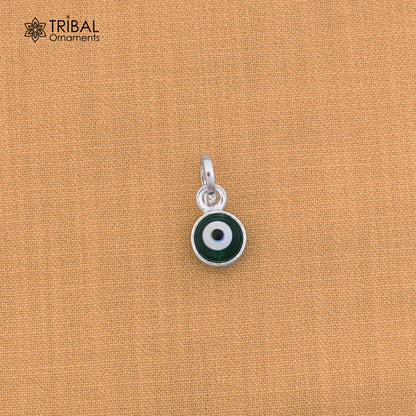 Sterling silver evil eye pendant for girls and kids, protective jewelry by Tribal Ornaments, featuring a blue and silver design.