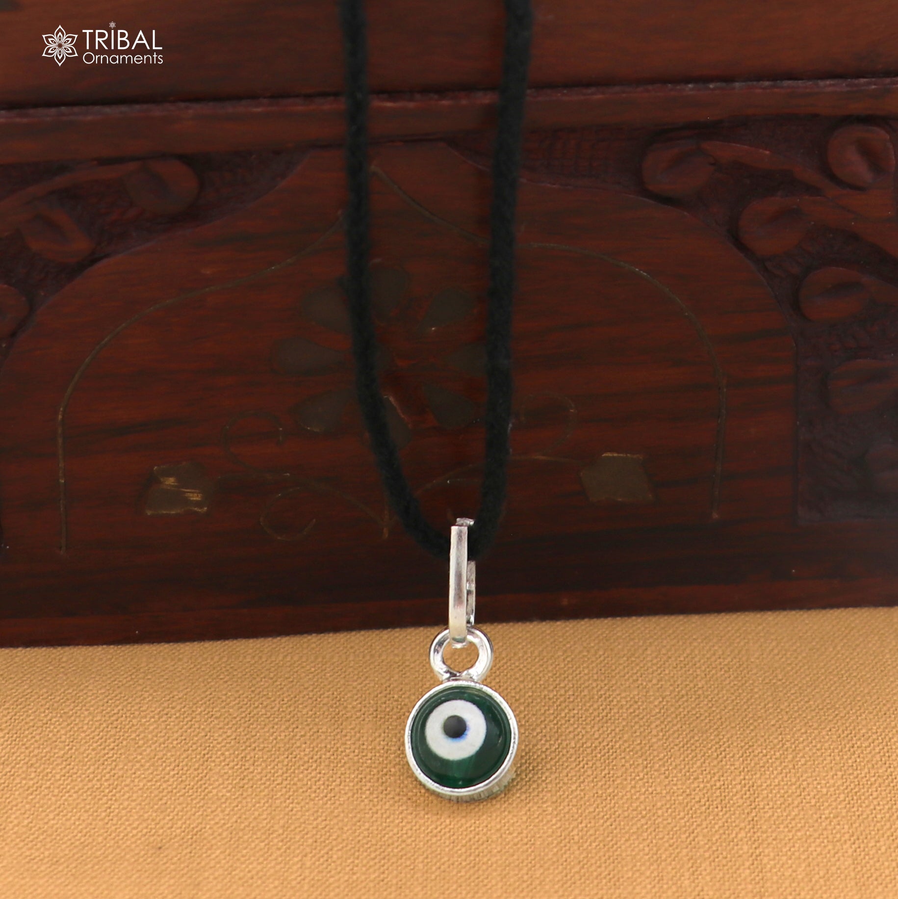 Sterling silver evil eye pendant for girls, crafted by TRIBAL ORNAMENTS, designed for protection jewelry, featuring blue and silver details.