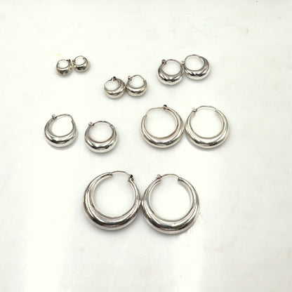 Sterling silver plain hoop earrings in various sizes, Bali tribal jewelry by TRIBAL ORNAMENTS, showing close-up of smooth silver hoops