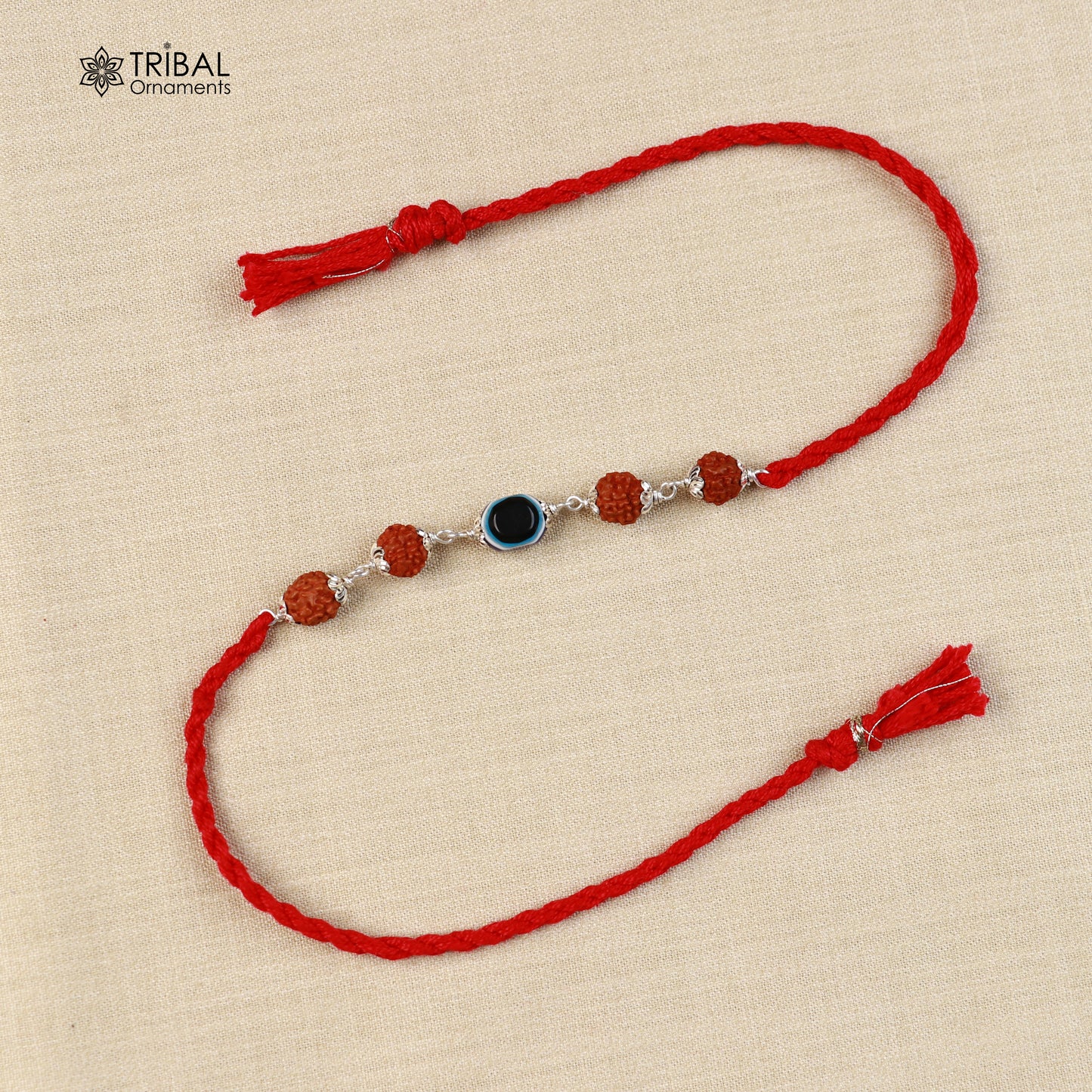 Sterling silver RUDRAKSHA and evil eye beads Rakhi bracelet with red thread, handmade by Tribal Ornaments.