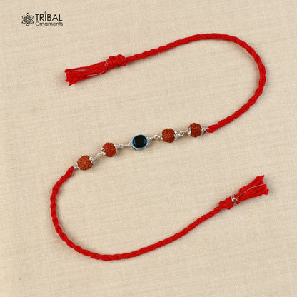 Sterling silver RUDRAKSHA and evil eye beads Rakhi bracelet with red thread, handmade by Tribal Ornaments.