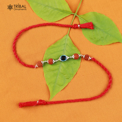 Sterling silver Rudraksha and evil eye beads red thread Rakhi bracelet with intricate design for special occasions.