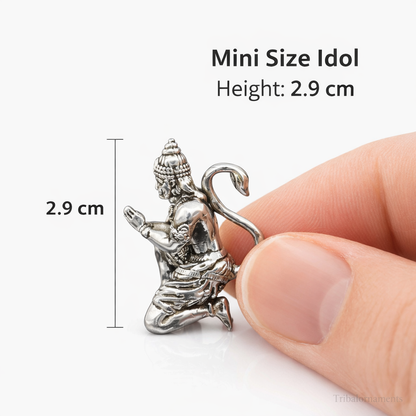 Miniature 925 silver Hanuman idol by Tribal Ornaments, held between fingers, ideal for puja and car dashboard decor.