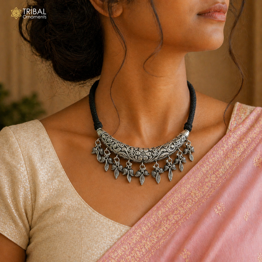 Indian traditional sterling silver kandrai charm necklace with tribal design, includes hasali and choker, part of tribal jewelry set.
