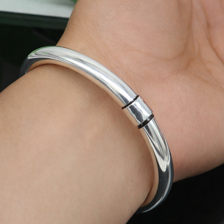 Shiny 925 sterling silver bangle bracelet with a smooth, plain design, suitable for men and women, by TRIBAL ORNAMENTS.