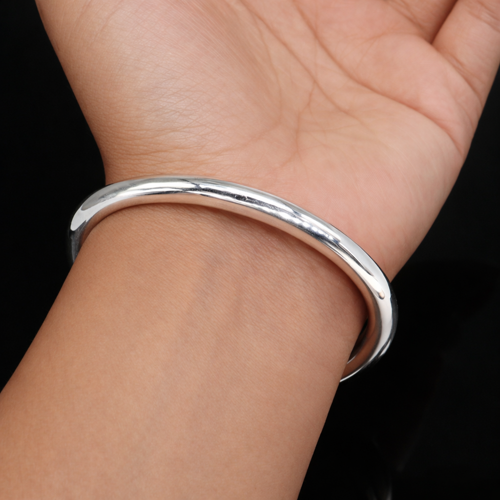 Shiny 925 sterling silver bangle bracelet with a smooth plain design, suitable for men or women, handcrafted by TRIBAL ORNAMENTS.