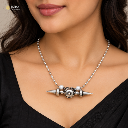 Vintage 925 sterling silver beaded chain amulet necklace set with tribal pendant, worn as a choker on a model.