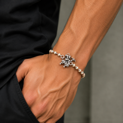 Sterling silver Flying Hanuman Rakhi bracelet with Rudraksha and Tulsi beads, intricate designs by TRIBAL ORNAMENTS.