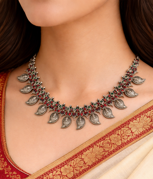 Sterling silver Goddess Laxmi necklace with colorful cut stones, handcrafted wedding jewelry set featuring traditional Guttapusalu design.