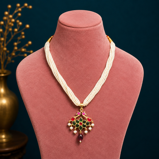 Sterling silver India kundan pendant with peacock design, paired with multi-strand pearl necklace from TRIBAL ORNAMENTS jewelry set.