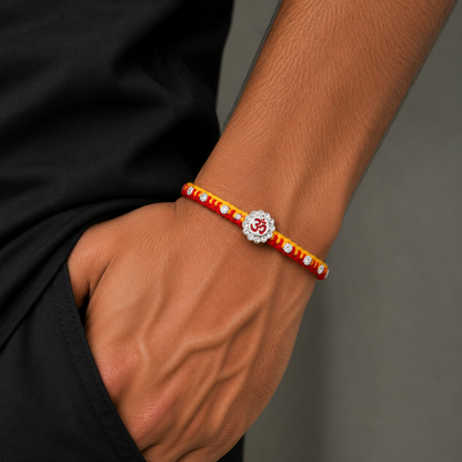 Sterling silver Om design thread rakhi bracelet with intricate detailing from TRIBAL ORNAMENTS, showcasing traditional craftsmanship.