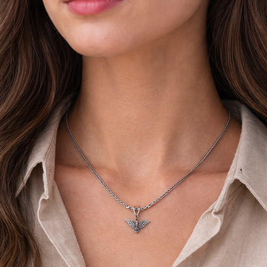 Sterling silver eagle bird pendant with tribal chain jewelry, featuring detailed eagle design and intricate craftsmanship.