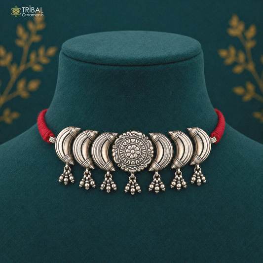 Sterling silver flower design ethnic charm necklace from TRIBAL ORNAMENTS, featuring intricate tribal jewelry style and floral details.