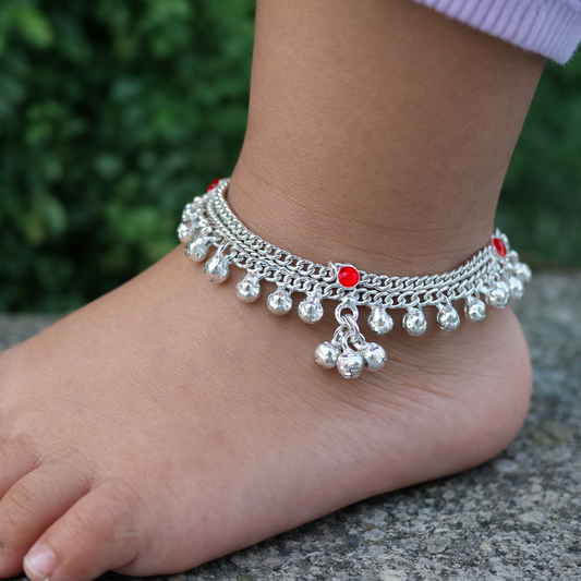 Sterling silver handmade baby ankle bracelet with small bells and customized charm, featuring delicate ankle jewelry design.