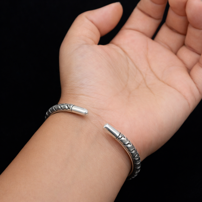 Sterling silver handmade chitai bangle cuff bracelet with tribal ethnic design by TRIBAL ORNAMENTS, showcasing intricate craftsmanship.