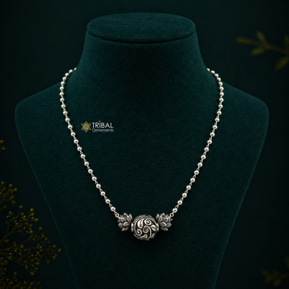Sterling silver handmade necklace with 4mm beads and traditional ball pendant, showcasing cultural and functional jewelry design.