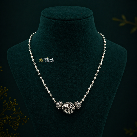 Sterling silver handmade necklace with 4mm beads and traditional ball pendant, showcasing cultural and functional jewelry design.