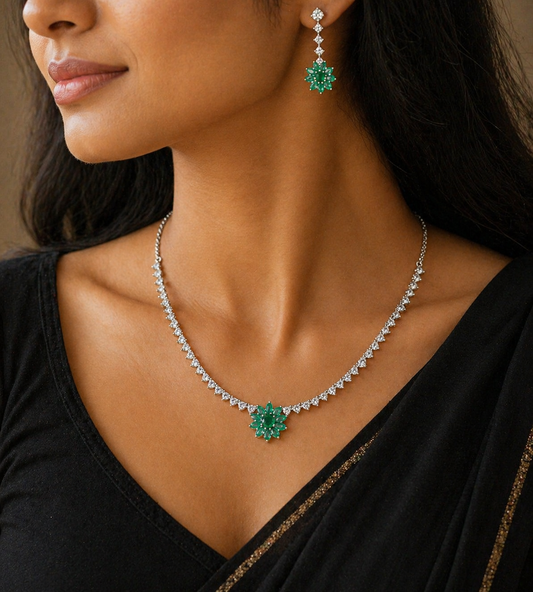 Sterling silver necklace with green cubic zirconia stones, intricate jewelry work, and bridal charm design by TRIBAL ORNAMENTS.