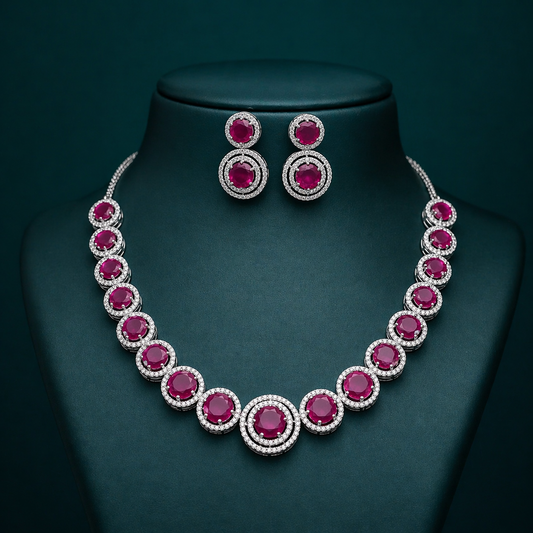 Sterling silver necklace with pink cubic zirconia stones and intricate charm design, ideal for weddings or special occasions.
