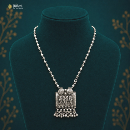 Sterling silver bird pendant with beaded necklace by TRIBAL ORNAMENTS, handcrafted tribal jewelry, ideal for boho and casual outfits.