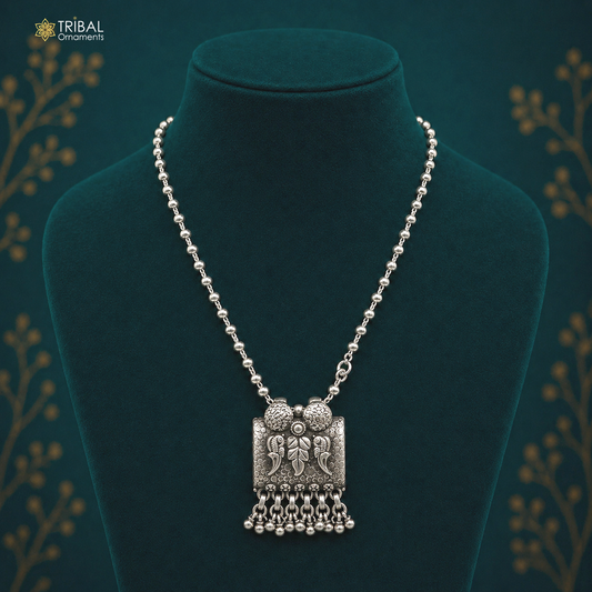 Sterling silver bird pendant with beaded necklace by TRIBAL ORNAMENTS, handcrafted tribal jewelry, ideal for boho and casual outfits.