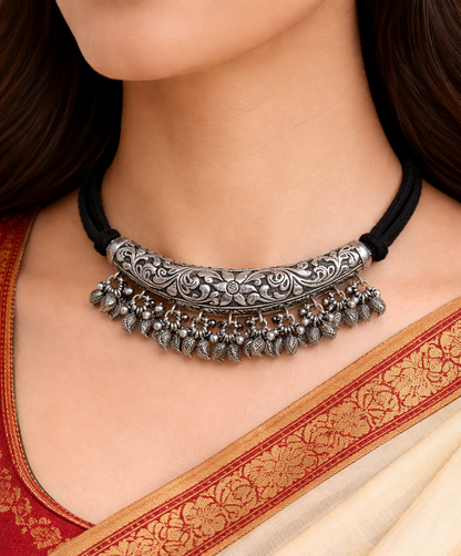 Vintage Indian sterling silver charm necklace with traditional chitai and kandrai work, tribal jewelry set with intricate designs.