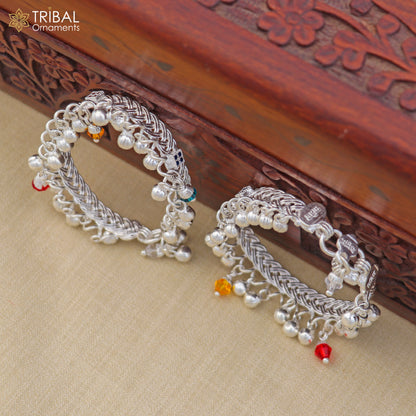 Sterling silver customized baby anklet with jingling charms by TRIBAL ORNAMENTS, featuring delicate design and adjustable fit.
