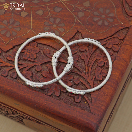 Sterling silver stylish baby bangle for kids jewelry by TRIBAL ORNAMENTS, featuring intricate design and smooth finish.